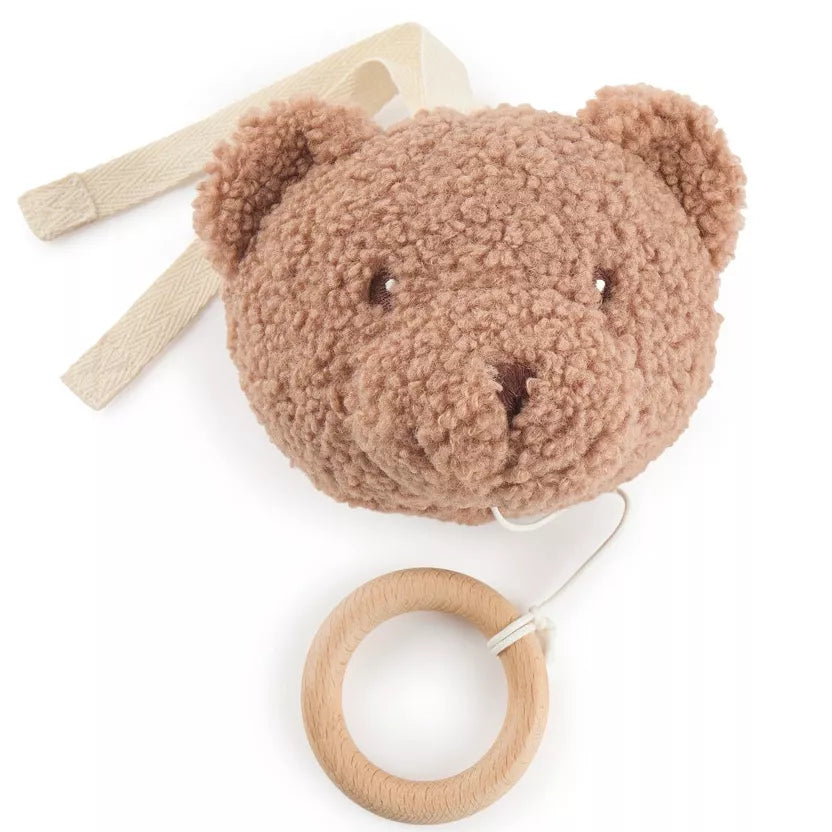 Grojantis meškiukas rudos spalvos, pakabinamas prie vaiko lovytės