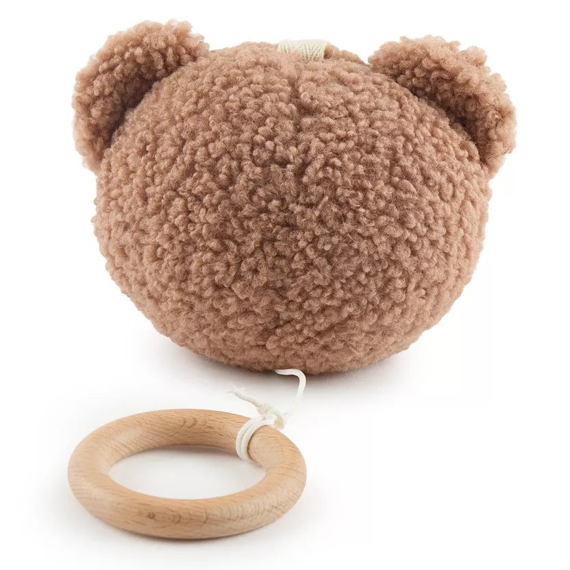 Grojantis meškiukas rudos spalvos, pakabinamas prie vaiko lovytės