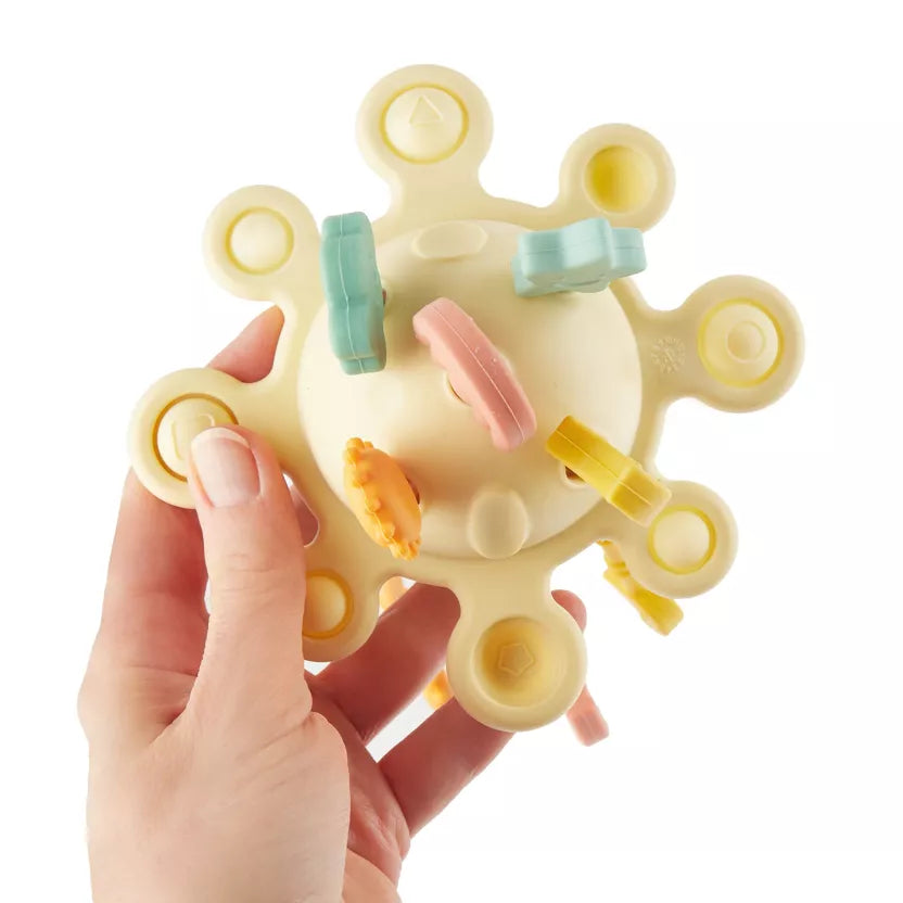 Montessori veiklos žaislas - silikoninė planeta, geltonos spalvos su tampomis spalvotomis dalimis