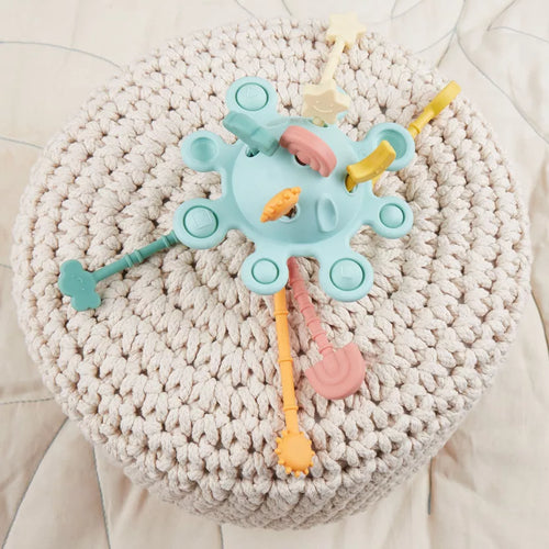 Montessori veiklos žaislas - silikoninė planeta, eukalipto spalvos su tampomis spalvotomis dalimis