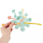 Montessori veiklos žaislas - silikoninė planeta, eukalipto spalvos su tampomis spalvotomis dalimis